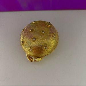 Vintage Houbigant gold pill container with sunburst detail/ beaded stars.